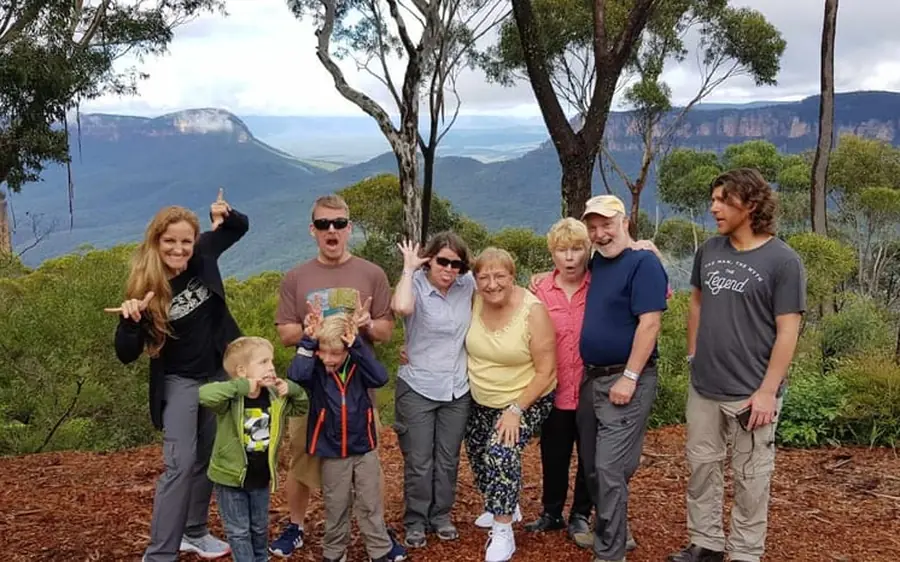 A small tour group at a lookout above the Blue Mountains
